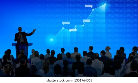 Corporate Businessman Giving A Presentation To A Large Audience