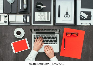 Corporate Businessman Working At Office Desk, He Is Networking With A Laptop, Flat Lay