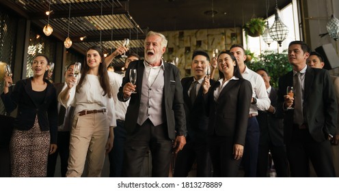 corporate businesspeople having business party toasting glasses of wine or champagne together to celebrate friendship and teamwork in special event such as corporate aniversary