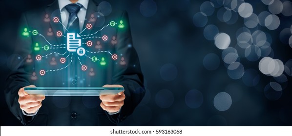 Corporate Data Management System (DMS) And Privacy Theme Concept. Businessman Or Programmer With Tablet And Scheme With Protected Document Connected With Users, Access Rights Symbolized By Key.