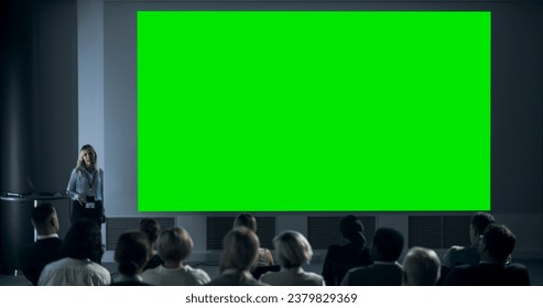 Corporate Event: Caucasian Female Tech CEO Giving Presentation On Green Screen Chromakey Projector Display To Colleagues In Conference Room Of Startup Office. Woman Talking About Business Objectives. - Powered by Shutterstock