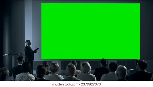 Corporate Event: Caucasian Male Tech CEO Giving Presentation On Green Screen Chromakey Projector Display To Colleagues In Conference Room Of Startup Office. Man Talking About Business Objectives. - Powered by Shutterstock