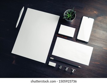 Corporate identity template. Branding mock up. Blank business stationery mock-up on wood table background.