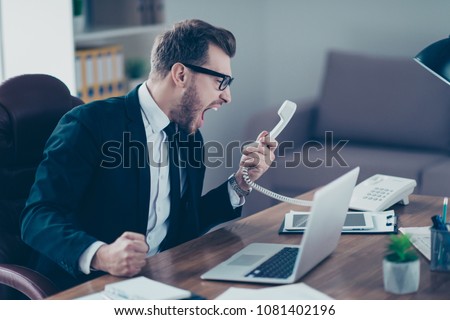 Corporate mad people yell authority tell speak with staff people person concept. Side profile view portrait of disappointed tired busy sad upset agent financier shouting on receiver in his hand