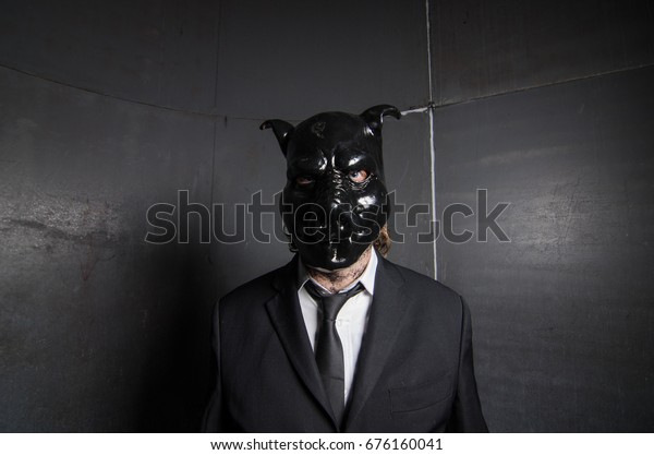 A corporate man in a\
dirty scruffy suit wearing a black pigs mask in a dark sinister\
background, photographed with moody cinematic lighting. evil dirty\
corporate pigs.