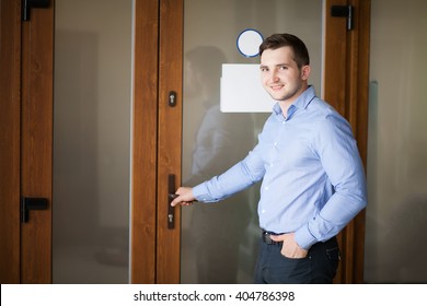 Corporate Man Opening His Office Door