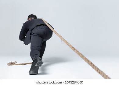 Corporate Man Pulling Rope Alone Hardwork