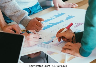 Corporate meeting. Creative millennial team working with graphic diagrams. Business analysis and strategy planning. - Shutterstock ID 1375376138