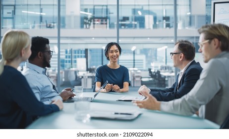 Corporate Meeting Room: Confident Asian Female Executive Director Makes a Report to a Members of the Board and Investors about Company’s Achievement of Record Breaking Annual Revenue Results.