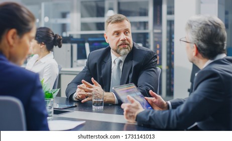 Corporate Meeting Room: During Negotiation Meeting Senior Executive Talking With Director About Company’s Results. He Comments Speakers Speech