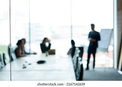 Corporate Movers And Shakers In Action. Shot Of A Group Of Executives Having A Meeting In A Boardroom.