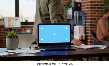 Corporate office with business people working with greenscreen on laptop, using blank chroma key background with isolated mockup copyspace. Company employees at job with technology. - Shutterstock ID 2174911615