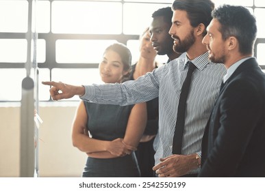 Corporate, people and pointing to whiteboard in office for planning schedule, information and staff reminder. Group, employees and meeting with proposal feedback, listen and calendar of project ideas - Powered by Shutterstock