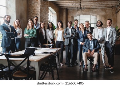 Corporate portrait of a multigenerational working team with multiracial and disabled members - Group photo of colleagues standing in the office in co-working space looking at the camera - lifestyle - Shutterstock ID 2166007405