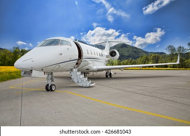 Corporate Private Jet - Plane On Runway In Mountains
