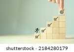 Corporate regulatory and compliance. Goals achievement and business success. Project and goals tracking. Task completion. Managing project timeline. Wooden cubes with target achievement icon.