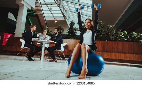 Corporate Sport Lifestyle. Healthcare Of Business People. Worker Relax In Office . Yoga Practice. Happy Office Manager. Woman Balance On Ball With Dumbbells . Girl Stretching On Work.