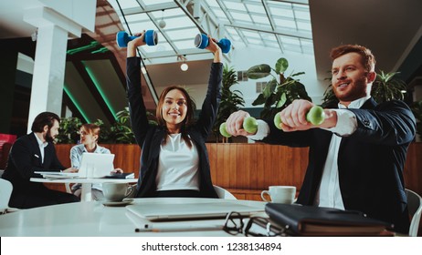 Corporate Sport Lifestyle. Healthcare Of Business People. Office Workers Working With Dumbbells. Workers Doing Fitness Exercises. Yoga Practice. Employee Man Smiling To Healthy Woman.