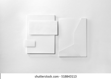 Corporate Stationery Set Mockup. Presentation Folder, Envelope, Letterheads Stack And Business Card At White Textured Paper Background. 