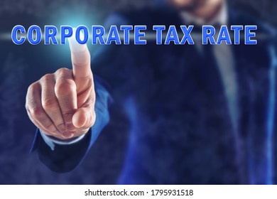 Corporate Tax Rate. Man Touching Virtual Screen On Color Background, Closeup