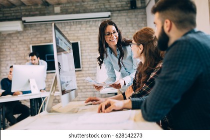 Corporate team working colleagues working in modern office - Shutterstock ID 628142273
