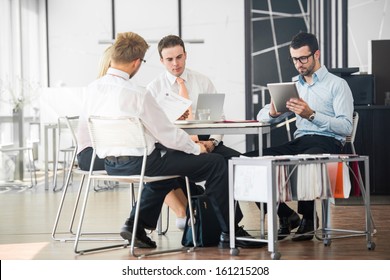 Corporate Team Working On A Meeting In Office