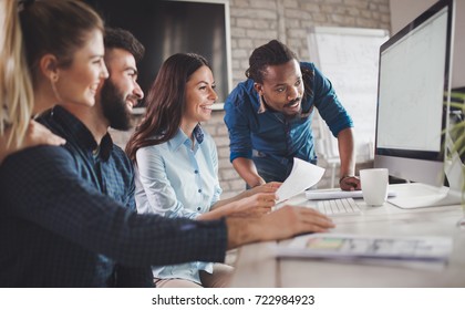 Corporate teamworking colleagues in modern office - Shutterstock ID 722984923