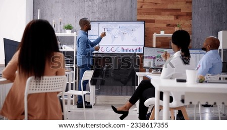 Corporate Training Presentation In Classroom With Computers