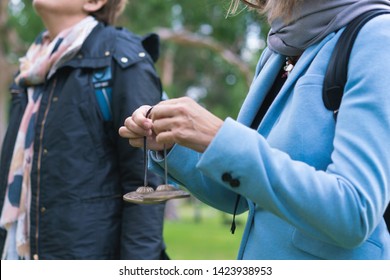 Corporate Workshop Facilitator Holding Meditation With Chimes