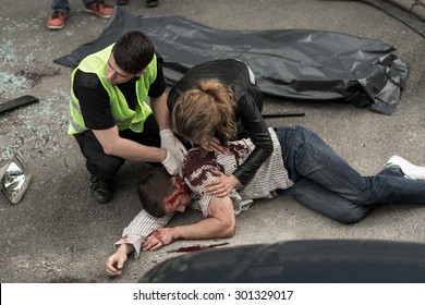 Corpse Of Young Man Lying On The Street