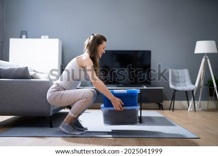 Correct Box Lifting Posture. Heavy Weight Lift