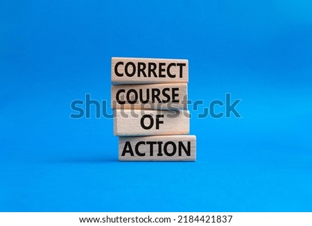 Correct course of action symbol. Concept words Correct course of action on wooden blocks. Beautiful blue background. Business and Correct course of action concept. Copy space.
