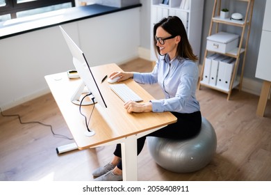 Correct Posture At Desk In Office Using Fitness Ball