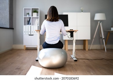 Correct Posture At Desk In Office Using Fitness Ball