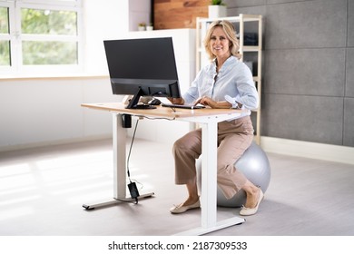 Correct Posture At Desk In Office Using Fitness Ball