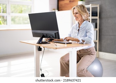 Correct Posture At Desk In Office Using Fitness Ball