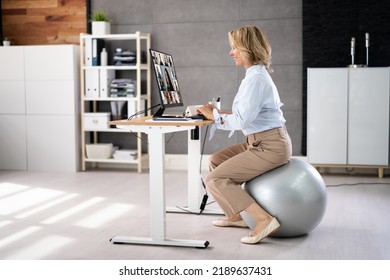 Correct Posture At Desk In Office Using Fitness Ball