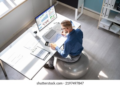 Correct Posture At Desk In Office Using Fitness Ball