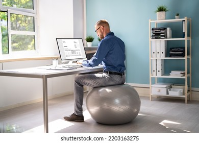 Correct Posture At Desk In Office Using Fitness Ball