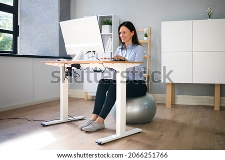 Correct Posture At Desk In Office Using Fitness Ball