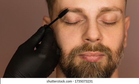 Correction Shape Of Man Eyebrow. Combing Eyebrows And Giving Direction Of Hair Growth. Work Of Master Barber, Brow Care Concept.