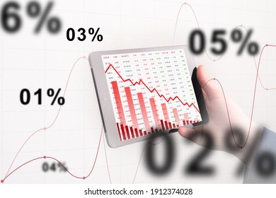 Correction In Stock Market. Large-scale Correction Of Share Price. Correction Of Stock Indices. Chart With Declining Quotes As A Symbol Of A Stock Market Crash. Tablet In Hand Of Trader In Background