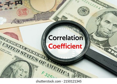 Correlation Coefficient.Magnifying Glass Showing The Words.Background Of Banknotes And Coins.basic Concepts Of Finance.Business Theme.Financial Terms.