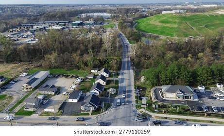 Corridor hillside blend shows residential homes, small commercial pads industrial buildings along White Marsh roadway with green hill stream shaping Perry Hall landscape, Maryland. USA