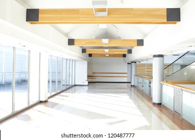 Corridor in office building with big windows passing daylight - Powered by Shutterstock