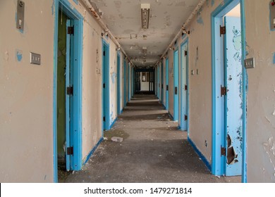 Corridor Of Prison Cell Doors Inside An Abandoned Prison.