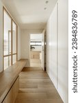 Corridor of a renovated apartment with smooth walls painted white