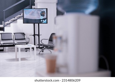 Corridor of waiting room of health facility equipped with patient seats and office furniture ready for examination. Hospital with no professional health workers or patients scheduling consultations. - Shutterstock ID 2314806209