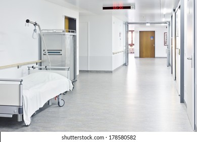 Corridor With White Bed In The Hospital With Trolley