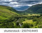 Corrieshalloch Gorge National Nature Reserve With River Through Pasture Valley And Loch Broom In Scotland